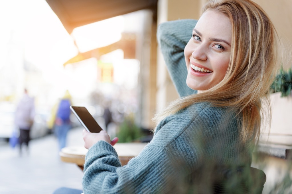 woman wearing a smartphone