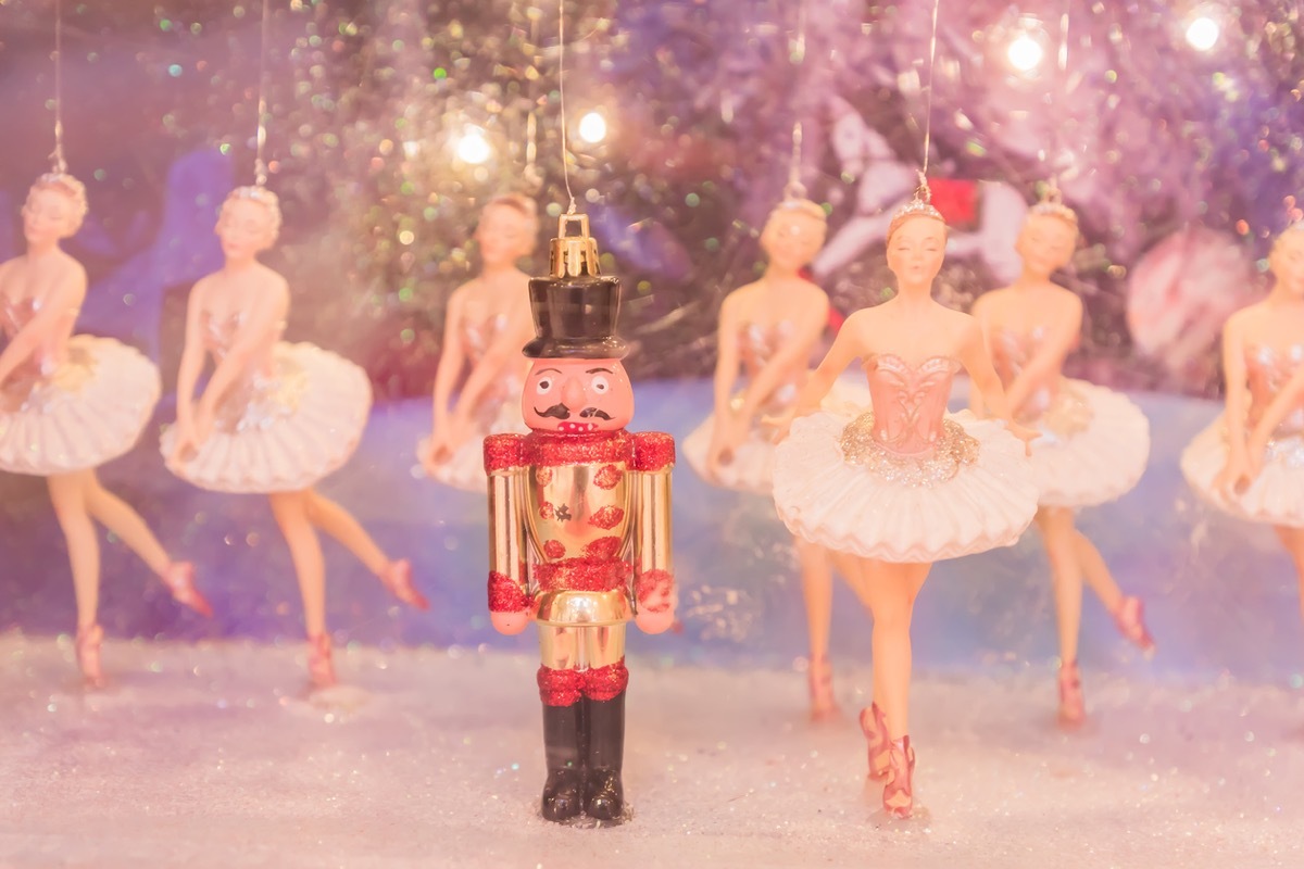 Christmas nutcracker toy soldier and balerina dolls on the stage.