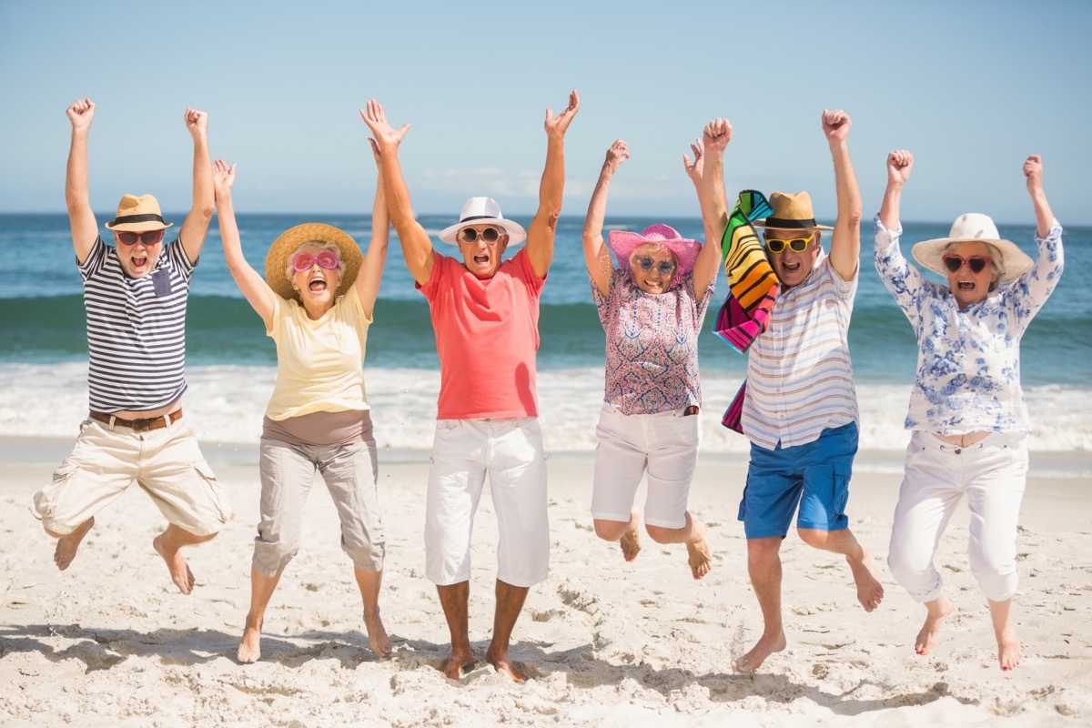 Portrait of senior friends at the beach on a sunny day