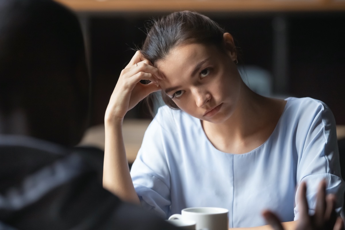 Woman looking annoyed at her companion