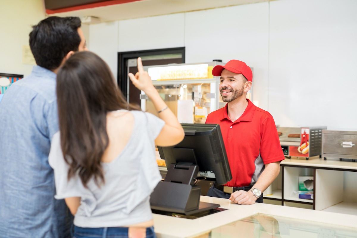 couple ordering food from concession stand