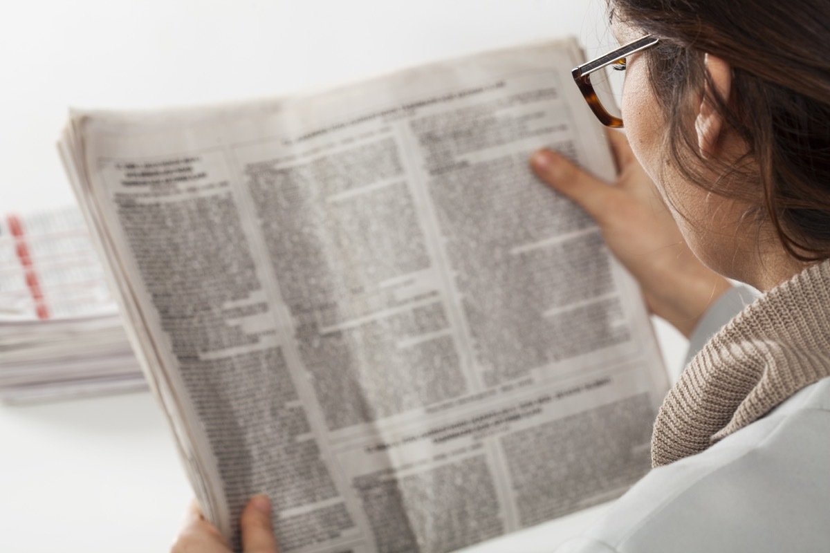 Woman reading a newspaper