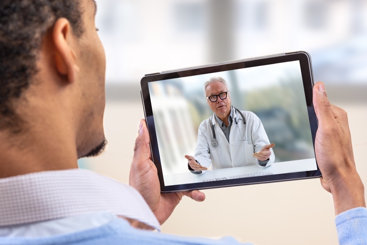 Man video chatting with doctor