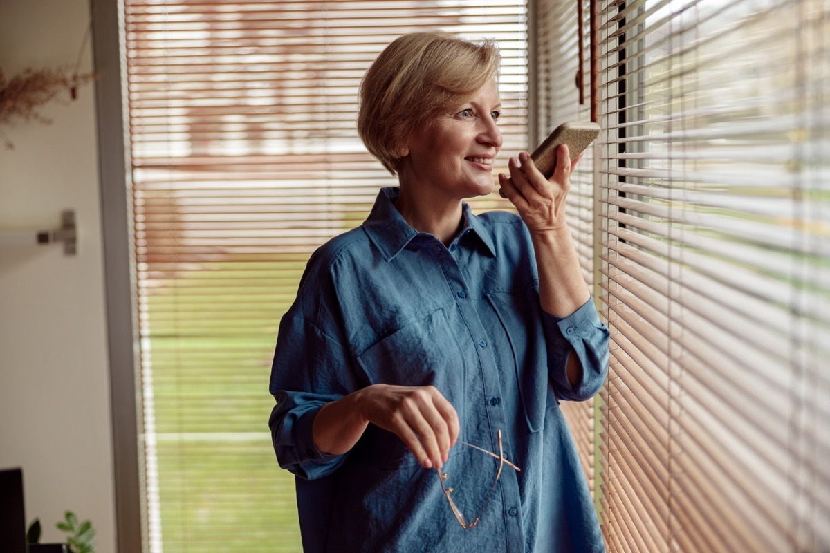 middle-aged woman talking into phone