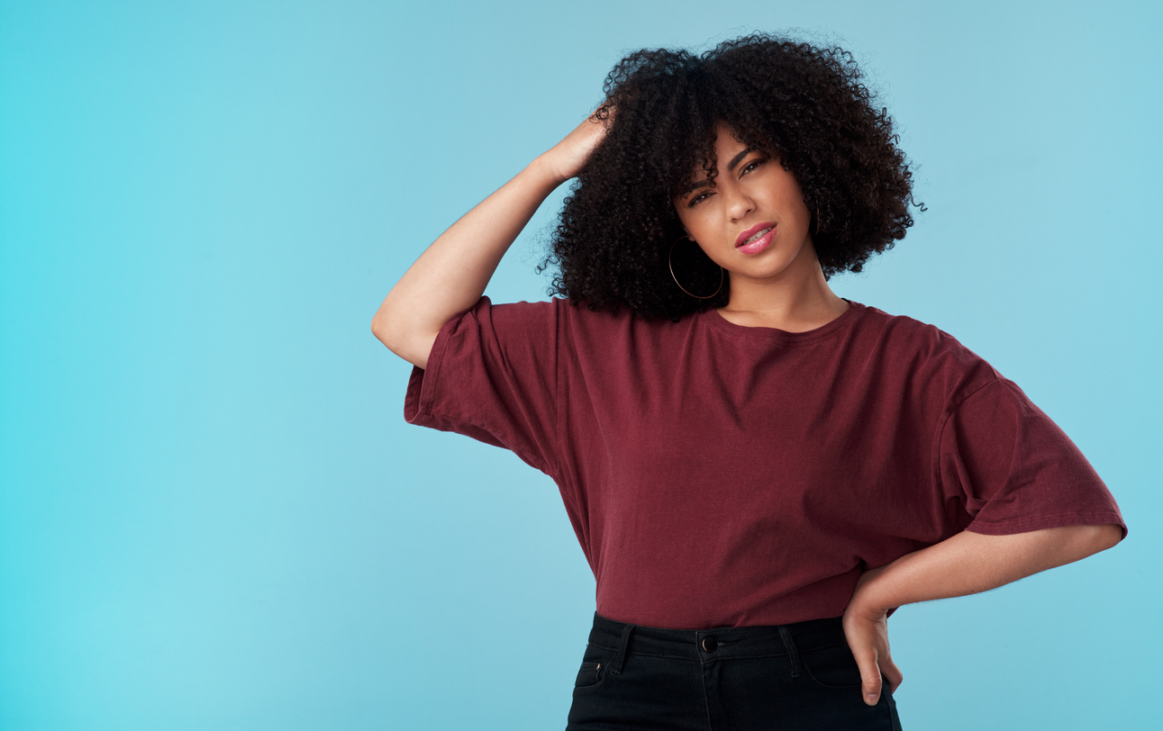 woman scratching her head - brain teasers for adults