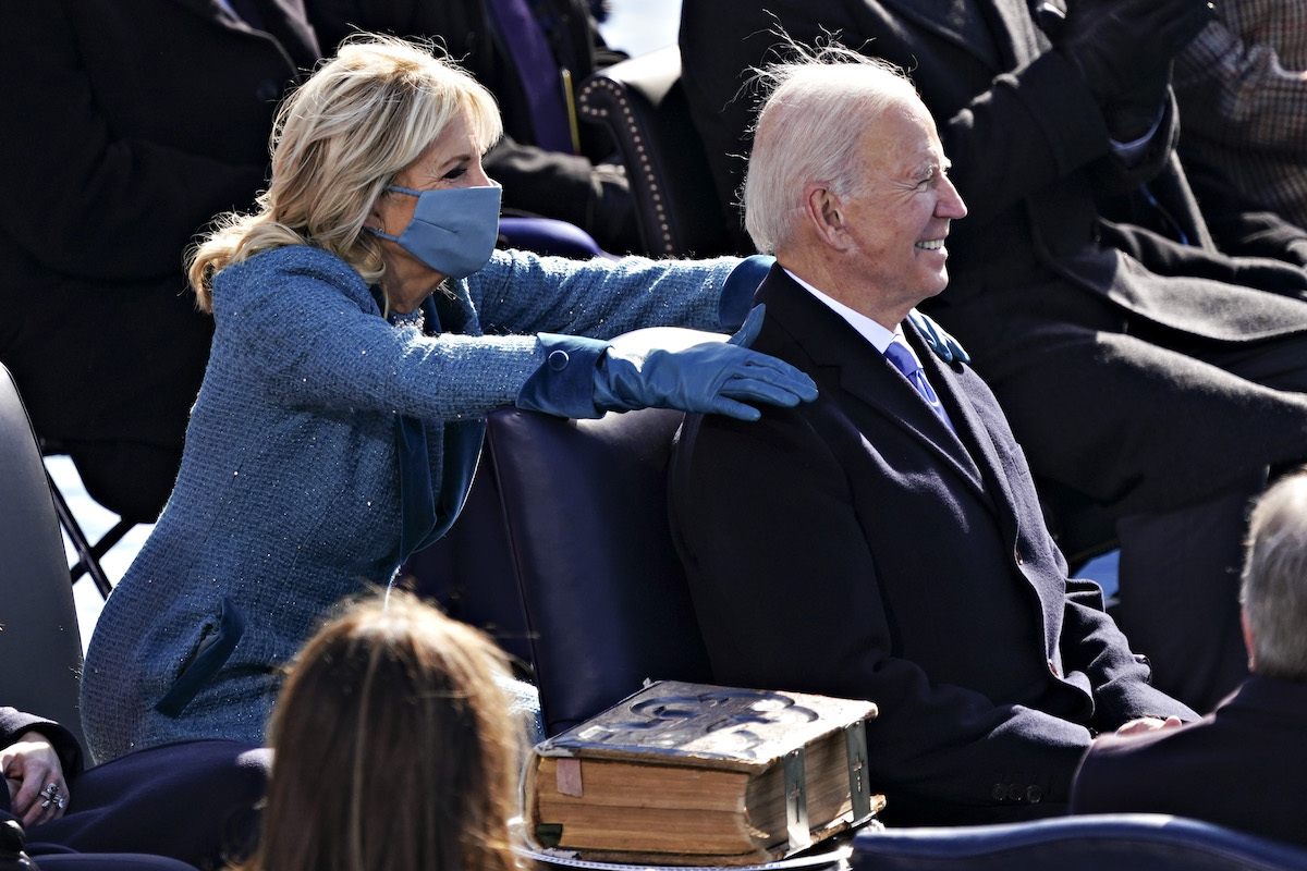 Incoming US First Lady Jill Biden (L) places her hands on US President-elect Joe Biden during his inauguration as US President, on the West Front of the US Capitol in Washington, DC on January 20, 2021.