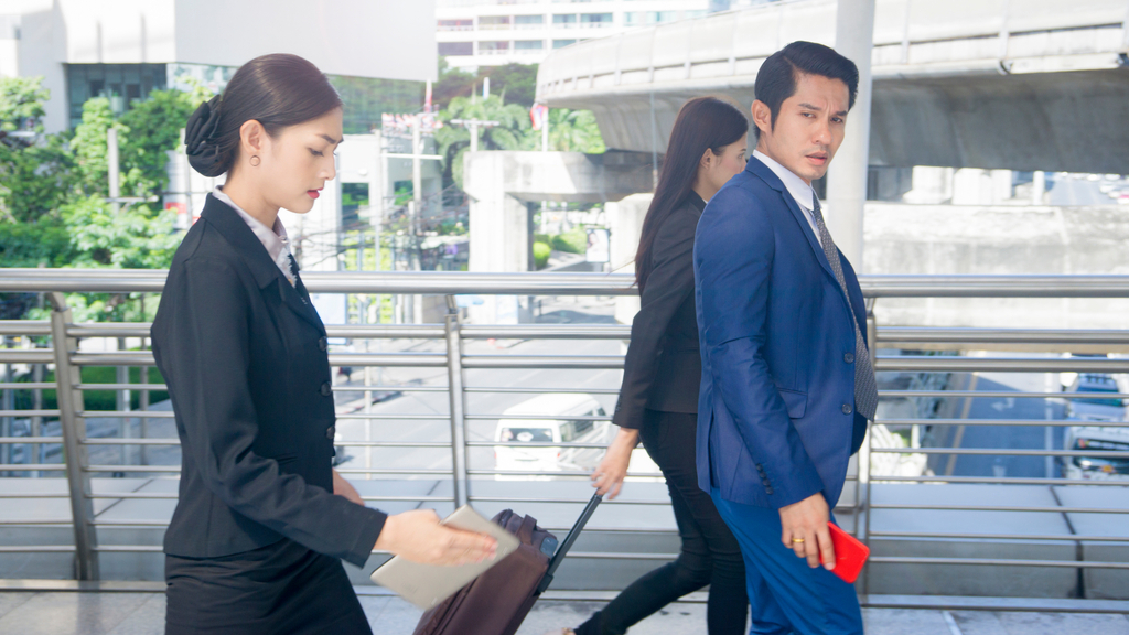 Businessman Moving Through Crowd Over 40