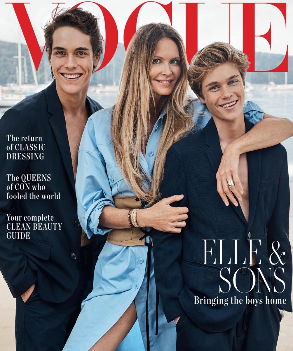 elle macpherson in a blue dress and her two sons in suits with no shirts on vogue australia cover