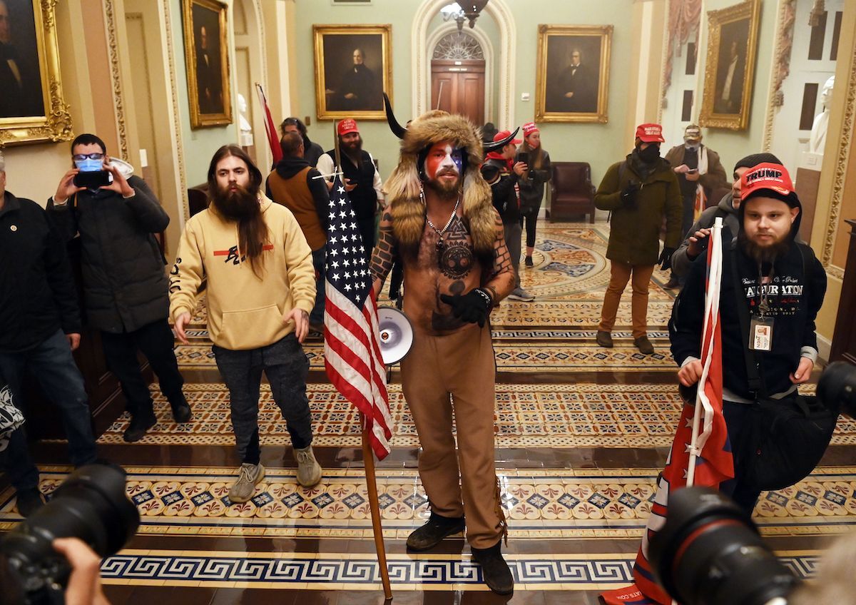 Supporters of US President Donald Trump enter the US Capitol on January 6, 2021, in Washington, DC. - Demonstrators breeched security and entered the Capitol as Congress debated the a 2020 presidential election Electoral Vote Certification.