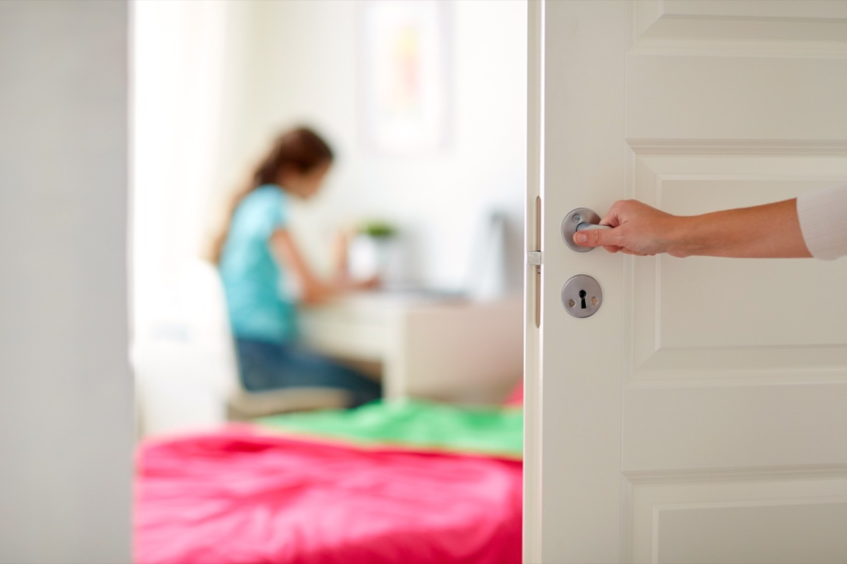 opening door to daughter's bedroom