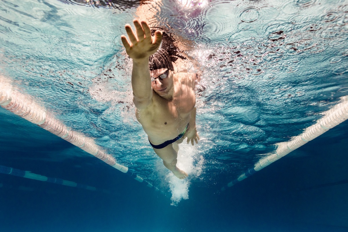 man exercising in swimming pool