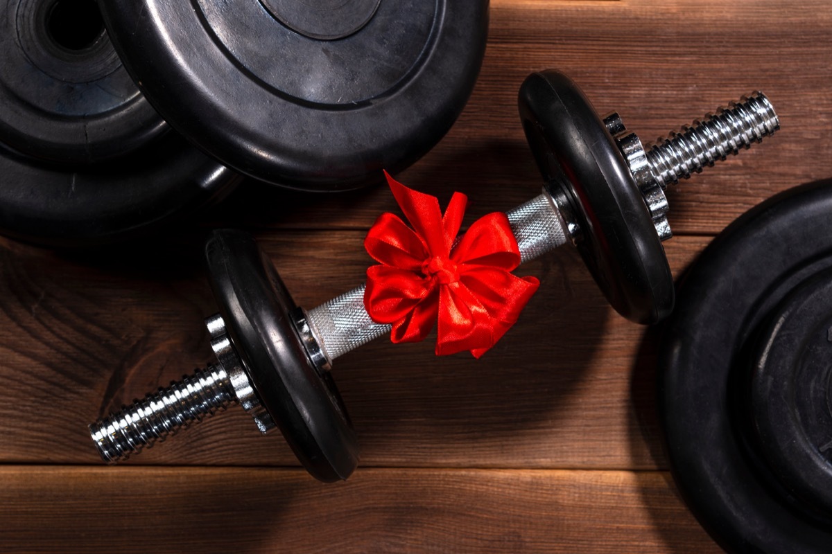 black dumbbell with red bow