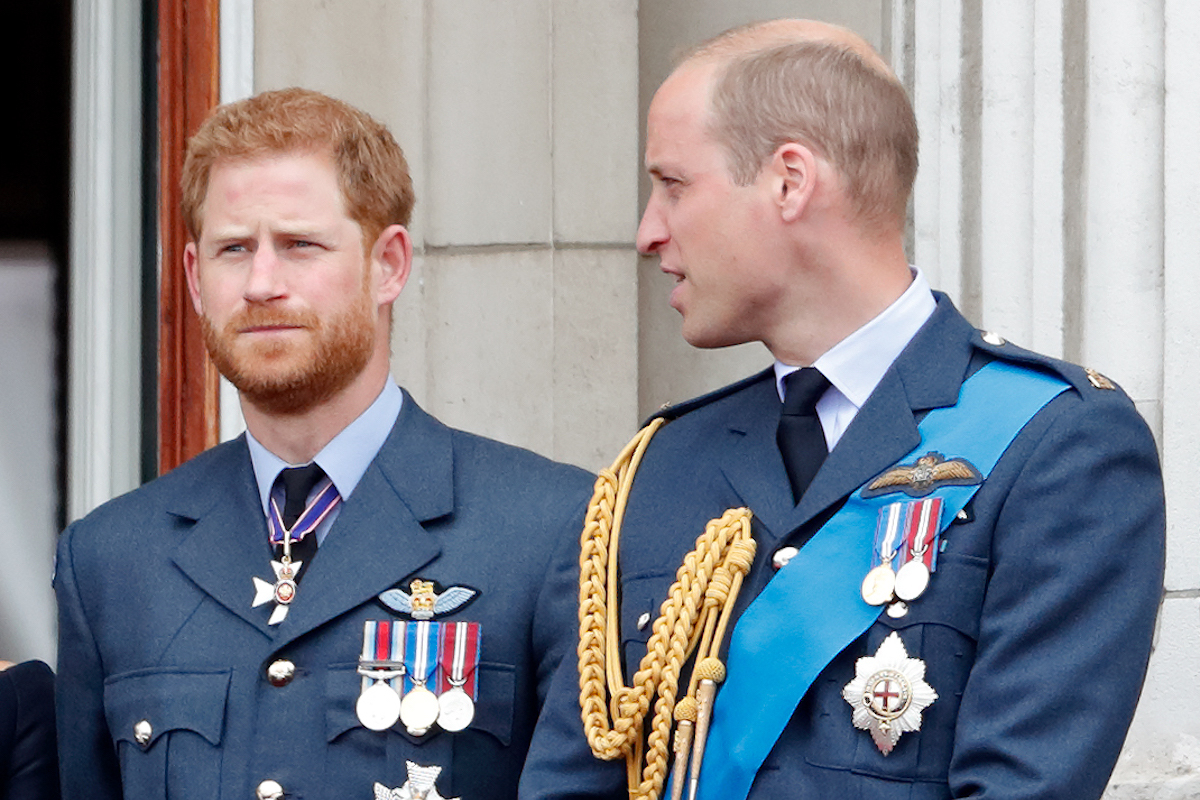 Prince Harry, Duke of Sussex and Prince William, Duke of Cambridge watch a flypast to mark the centenary of the Royal Air Force from the balcony of Buckingham Palace on July 10, 2018 in London, England.