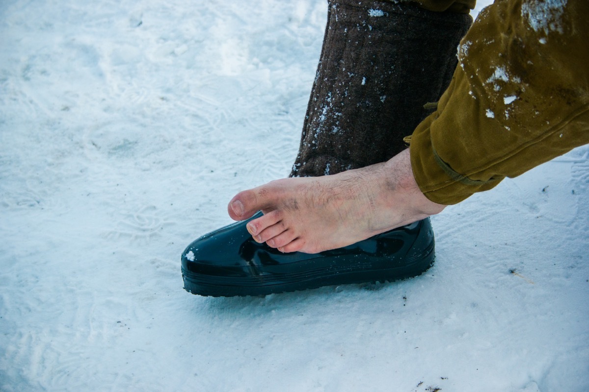 man with a foot injury in the winter