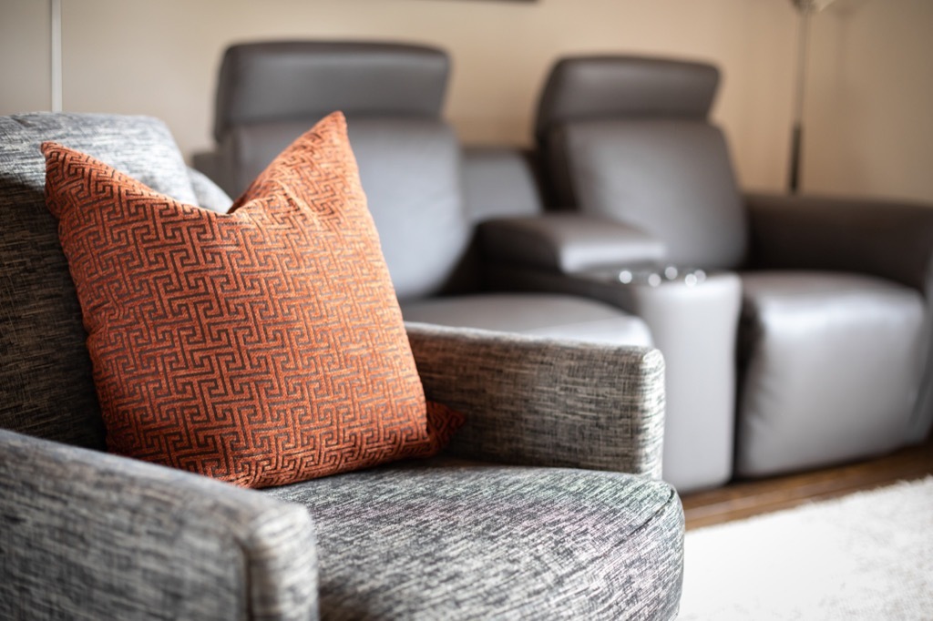 Living room with chairs of different materials