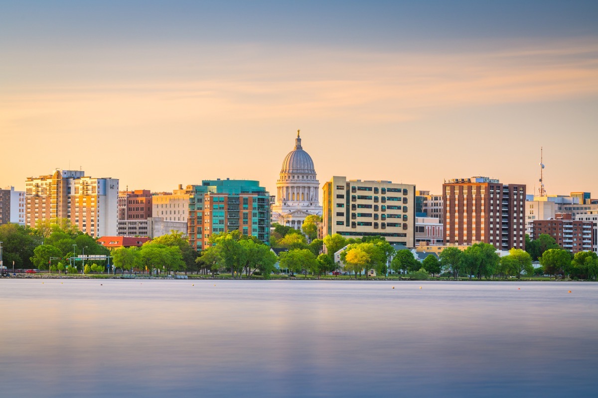 Madison, Wisconsin, USA downtown skyline at dusk on Lake Monona.