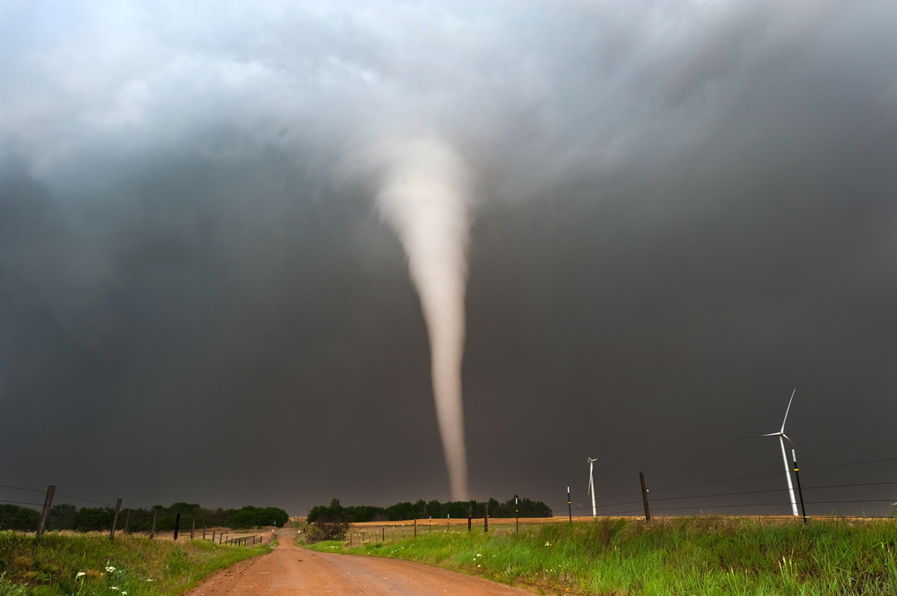 A tornado moving through a field