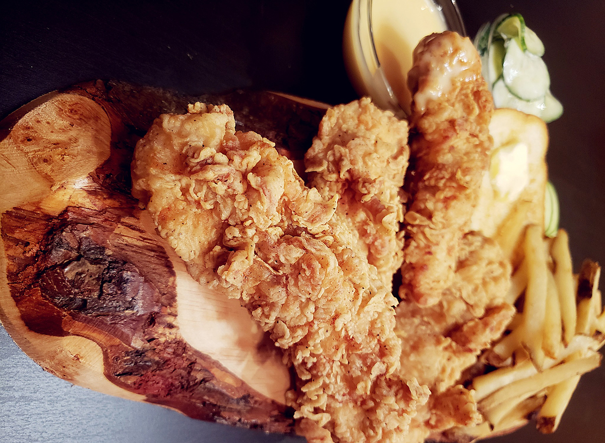 plate of chicken tenders and fries