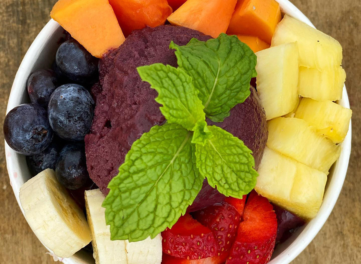 smoothie bowl topped with fresh fruit