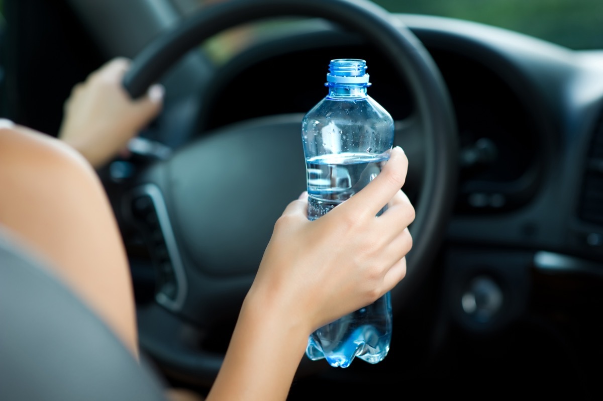 drinking water while driving car