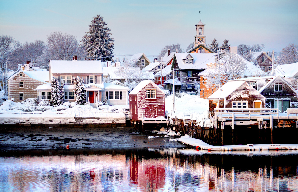 View across the lake of snow-covered houses in Portsmouth, New Hampshire.