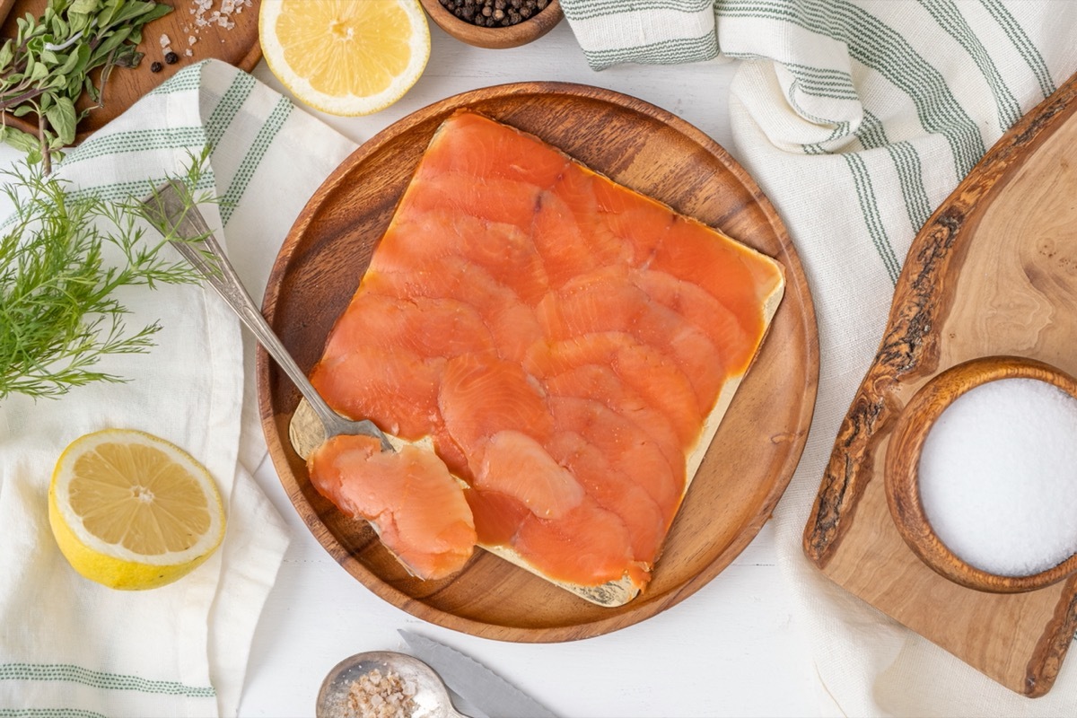 wooden plate with lox on it