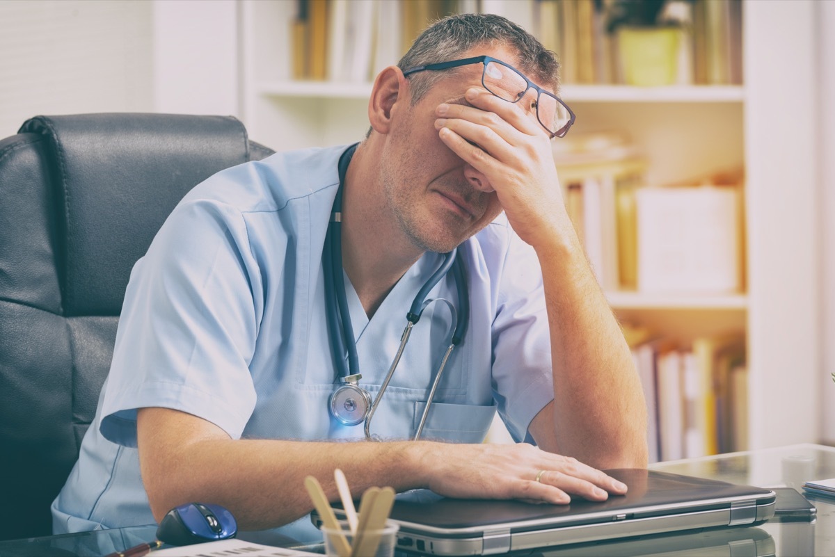 Overworked doctor sitting in his office