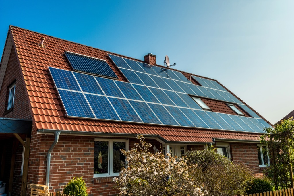 eco friendly house with solar panels roof