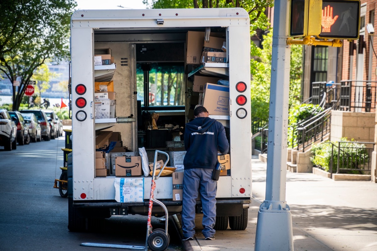 New York NY/USA-May 10, 2020 USPS worker sorts packages in the Greenwich Village neighborhood in New York