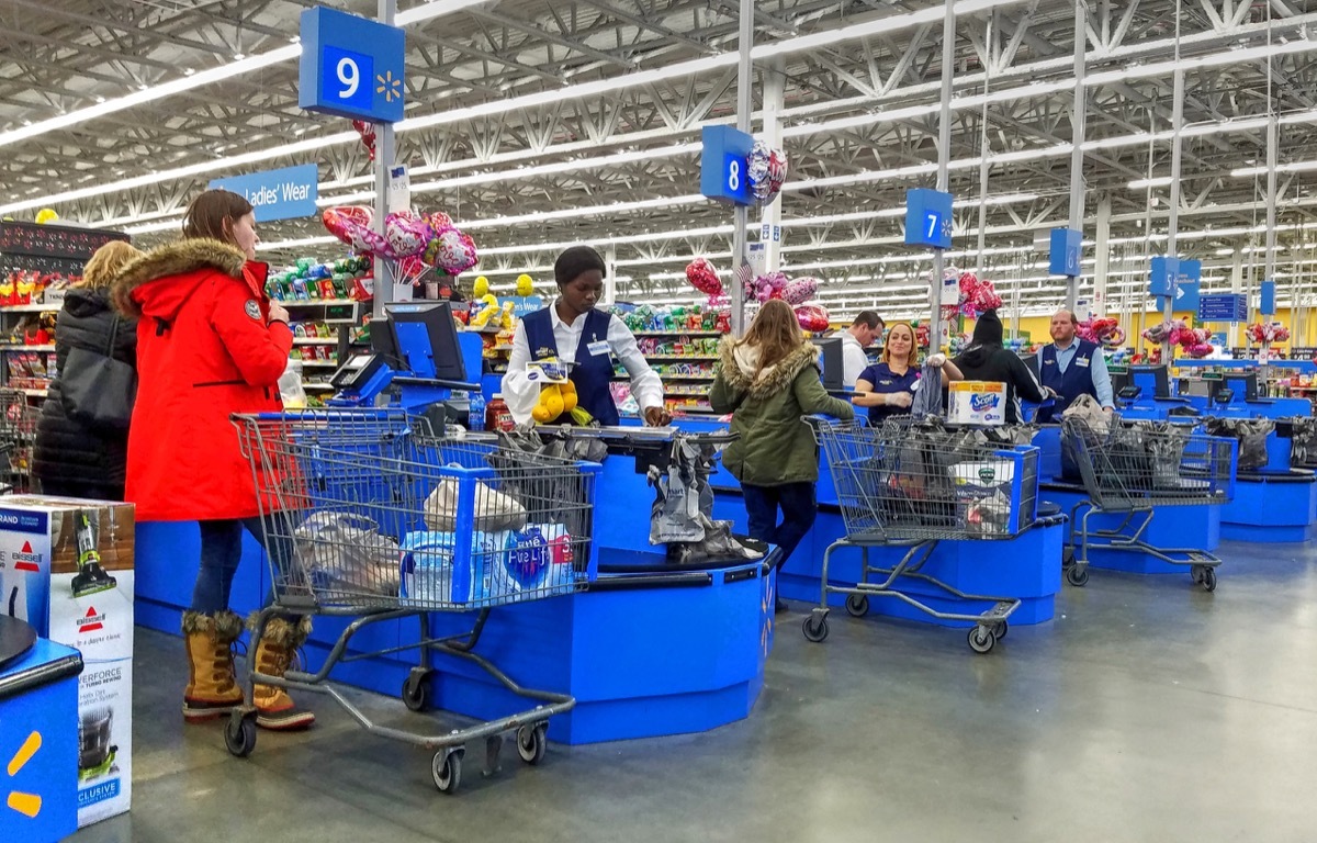 customers check out with Walmart cashier, no masks