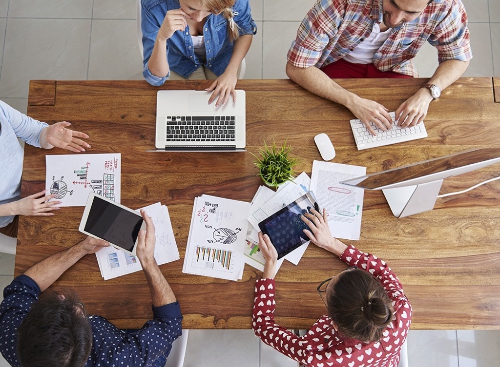 employees-at-table Smartest Men Get Ahead 